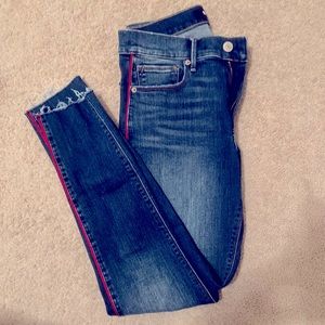 Express blue jeans with red detail on the sides